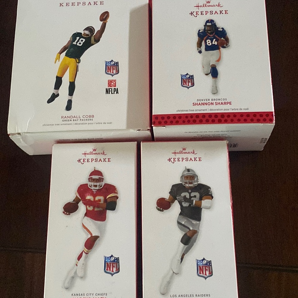 Four NFL Hallmark Ornaments NIB